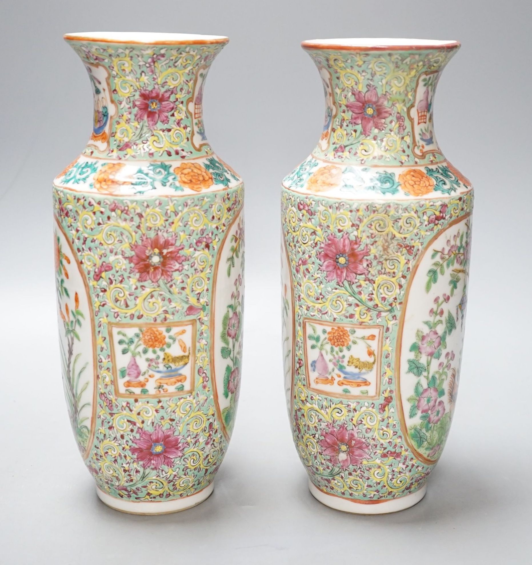 A pair of 19th century Chinese Canton decorated famille rose vases - 25cm tall